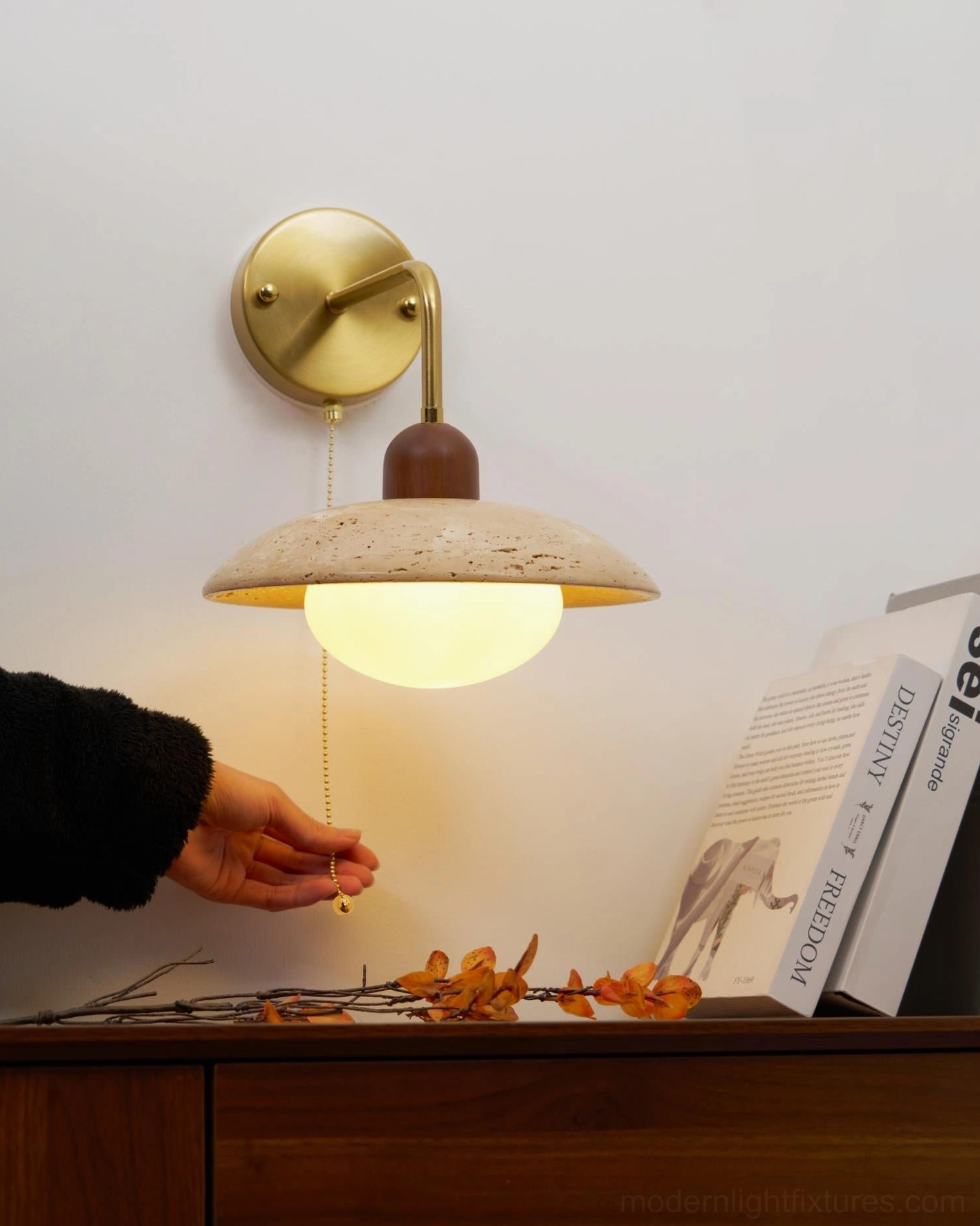 Travertine wall lamp installed in bedroom bedside creating intimate reading light atmosphere