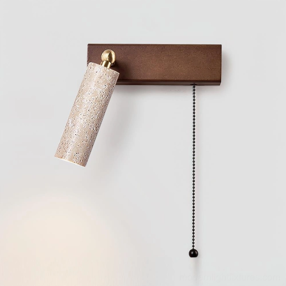 Modern travertine wall sconce featuring beige stone cylinder shade with pull chain – minimalist design studio shot