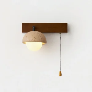 Minimalist travertine wall lamp detail showing frosted glass diffuser and wooden pull cord