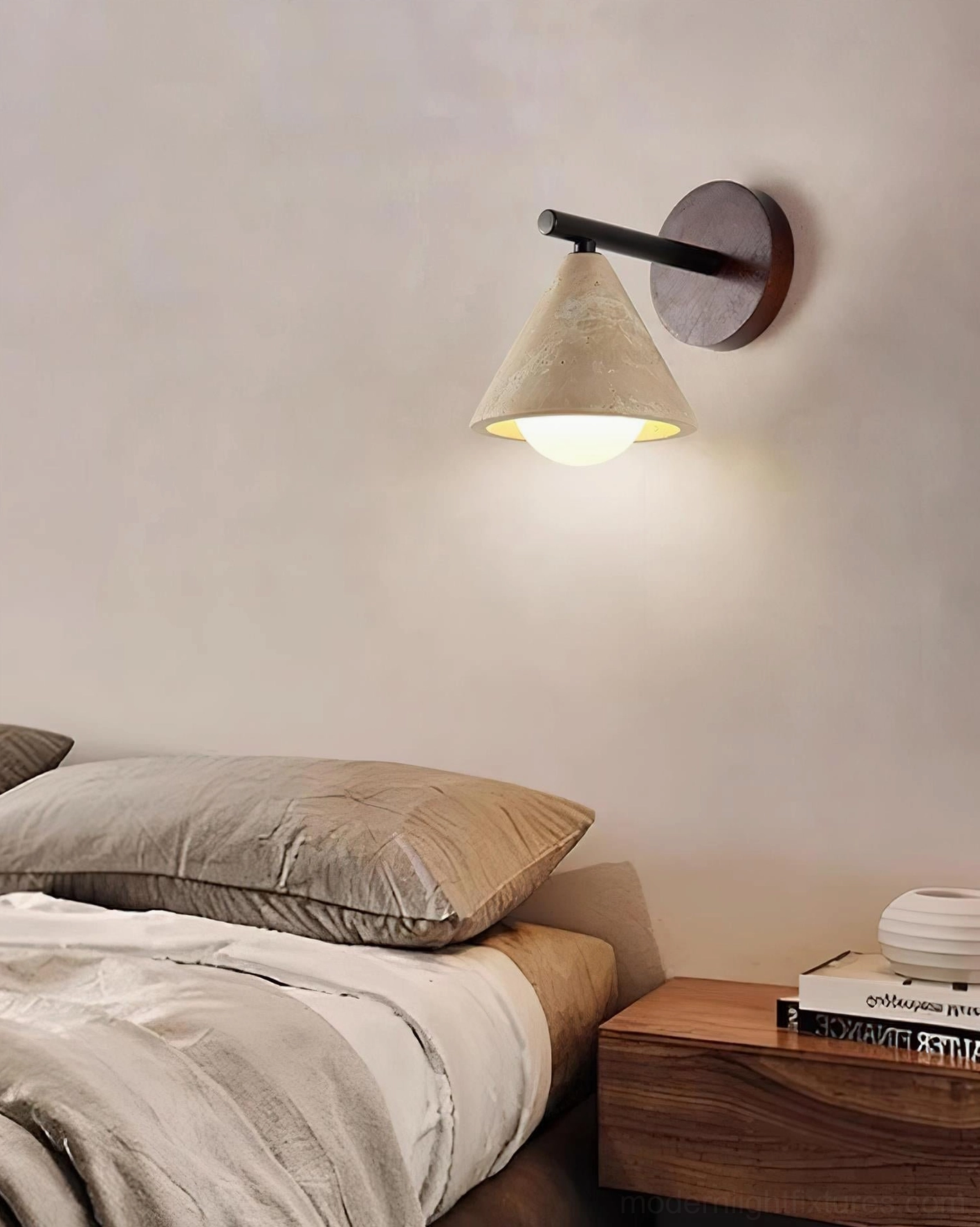 Modern travertine conical wall lamp with warm wood backplate architectural detail