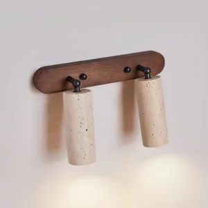 Ricerca 2-head travertine wall sconce three-quarter angle view with warm downlight casting on white background
