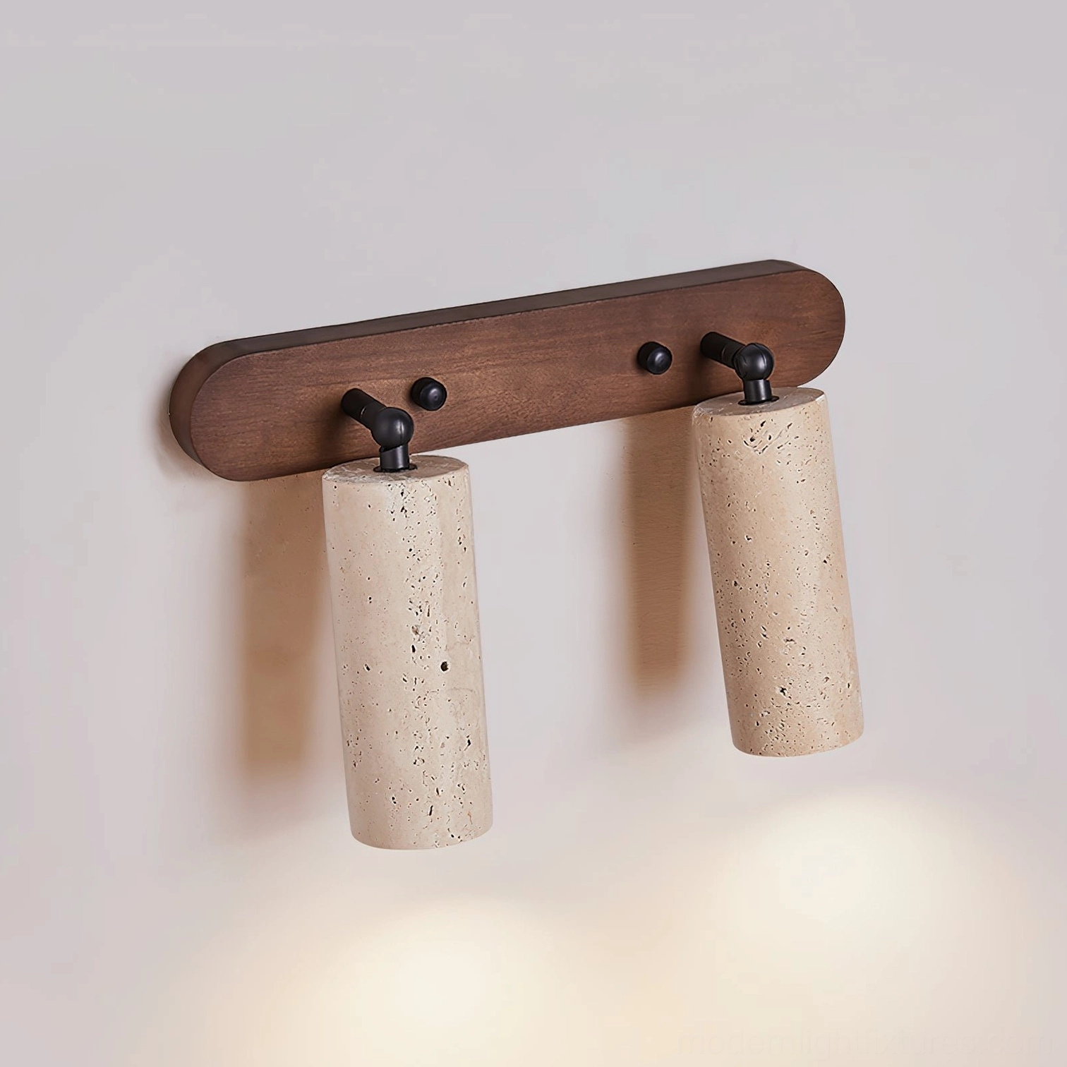 Ricerca 2-head travertine wall sconce three-quarter angle view with warm downlight casting on white background