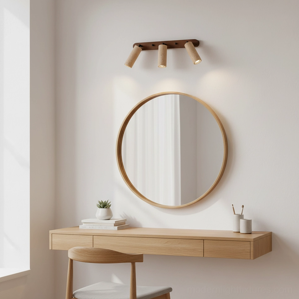 Ricerca 3-head travertine wall sconce in minimalist bedroom vanity setup with floating wooden vanity and round mirror