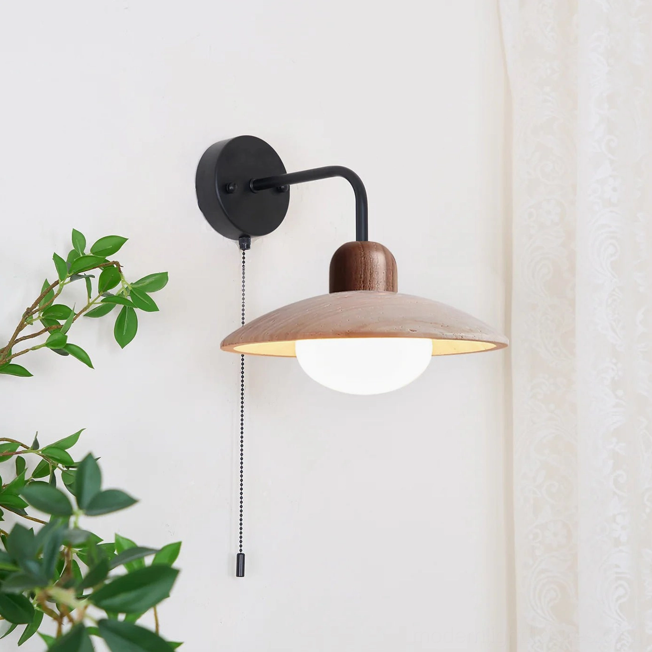Black and walnut travertine wall sconce variant shown in contemporary home lighting context