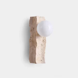 Travertine wall sconce with frosted glass globe, front studio view showing natural stone texture and irregular edge