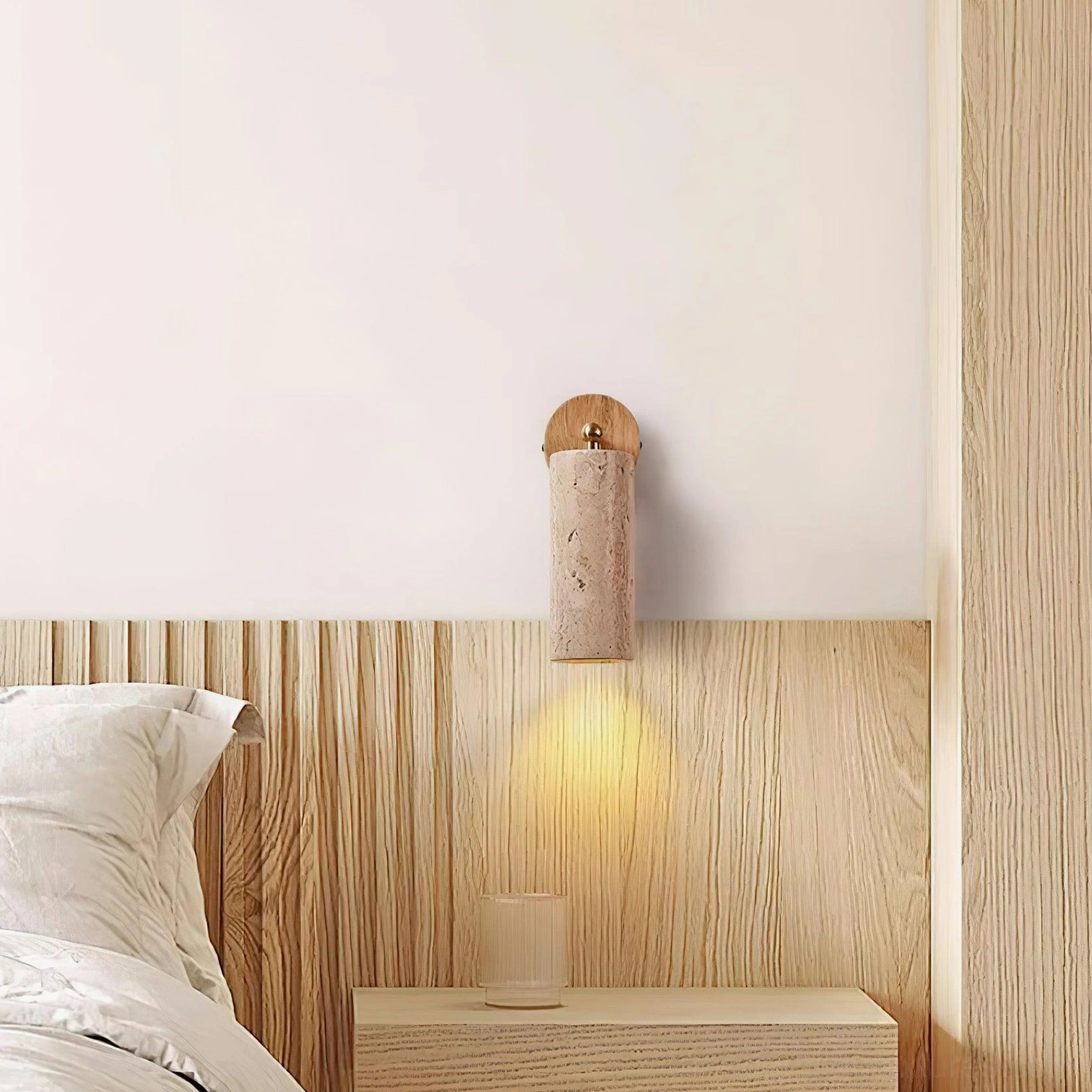 Mireille travertine wall sconce room setting with modern minimalist interior and warm accent lighting