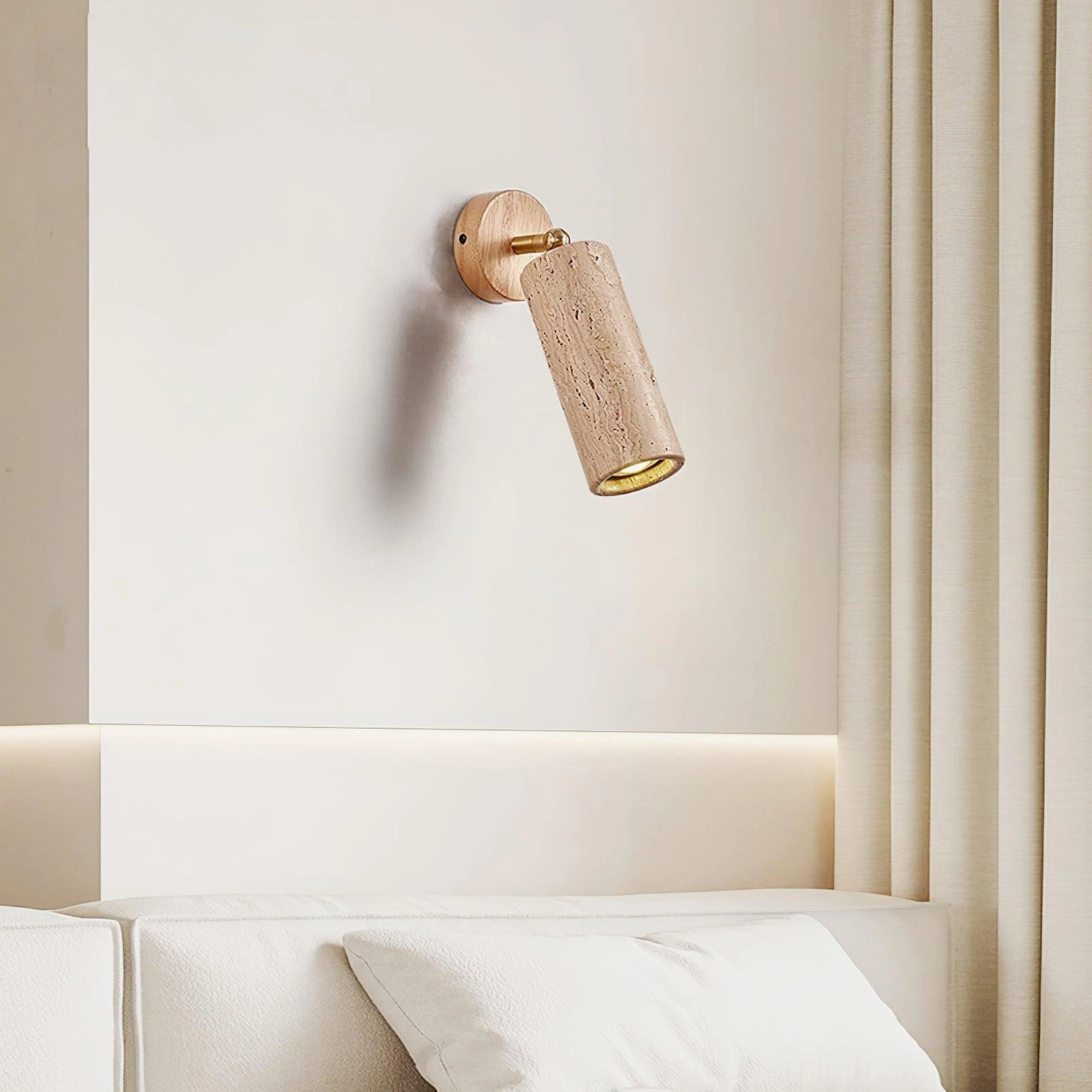 Mireille travertine wall sconce angled view highlighting swivel mount functionality and natural stone craftsmanship