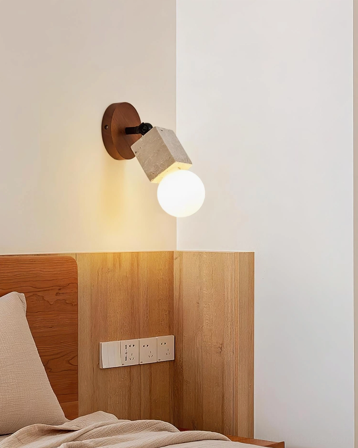 Travertine wall sconce warm glow lighting effect in contemporary home interior setting