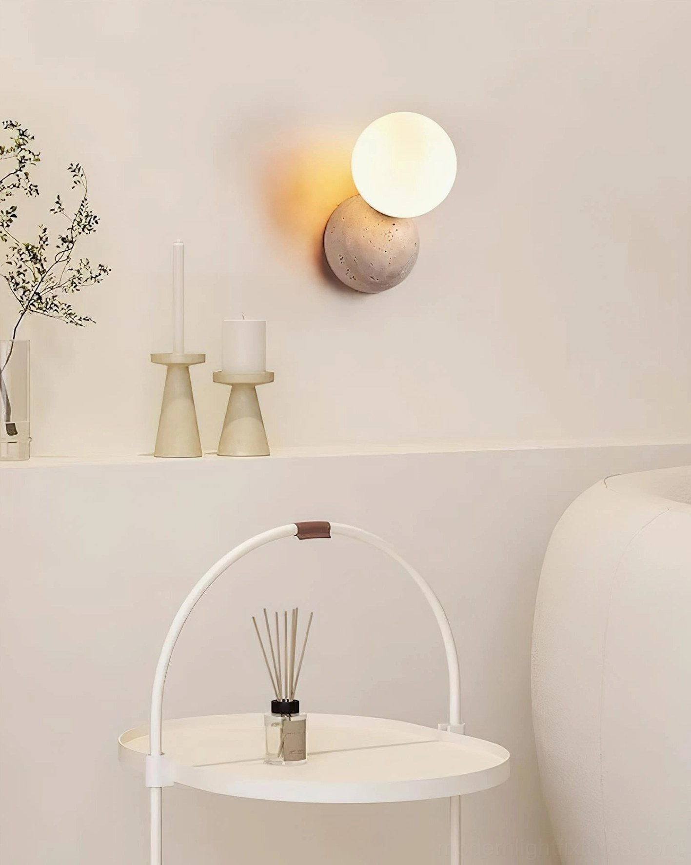 Travertine natural stone wall sconce with warm ambient glow, minimalist modern home lighting solution