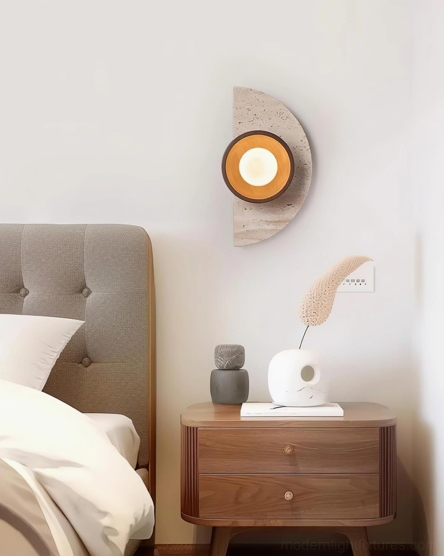 Modern travertine wall sconce mounted in rustic bedroom above wooden nightstand with neutral minimalist decor
