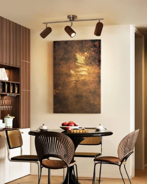 Installed Trevio track spotlight in modern dining room with warm ambient lighting and dark adjustable lamp heads