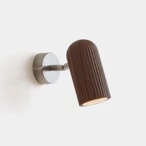 Trevio ribbed wood wall sconce front view with dark brown fluted wooden shade and nickel metal base on white background