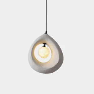 Tricia wabi-sabi teardrop pendant light front view with matte finish and hollow center, featuring warm glowing LED bulb against white studio background