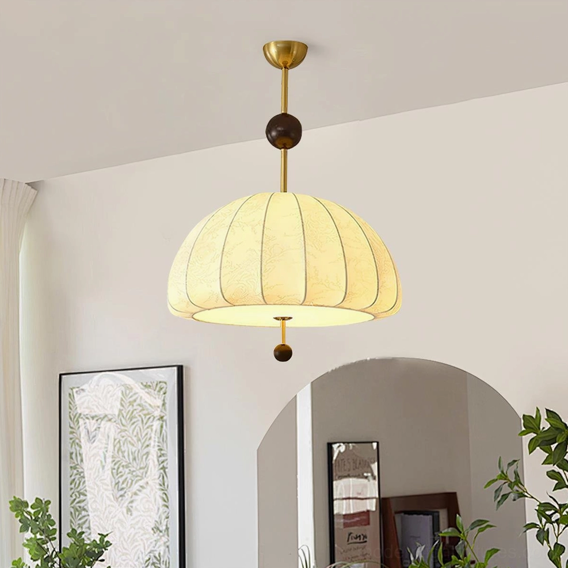 Trigg pendant light installed in warm vintage living room with neutral interior decor and soft ambient lighting from below