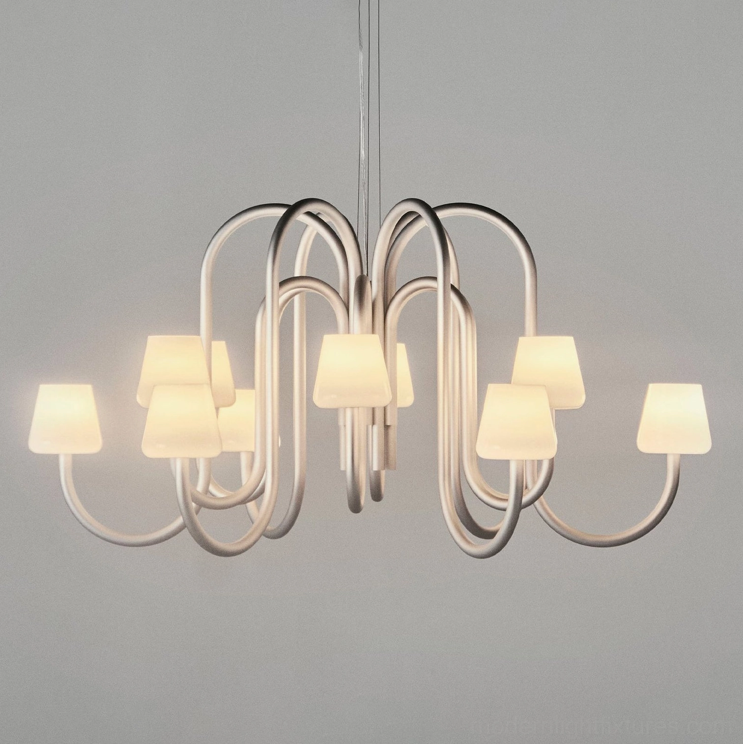 Trilo curved tube chandelier with bronze metal frame and warm amber lit glass shades