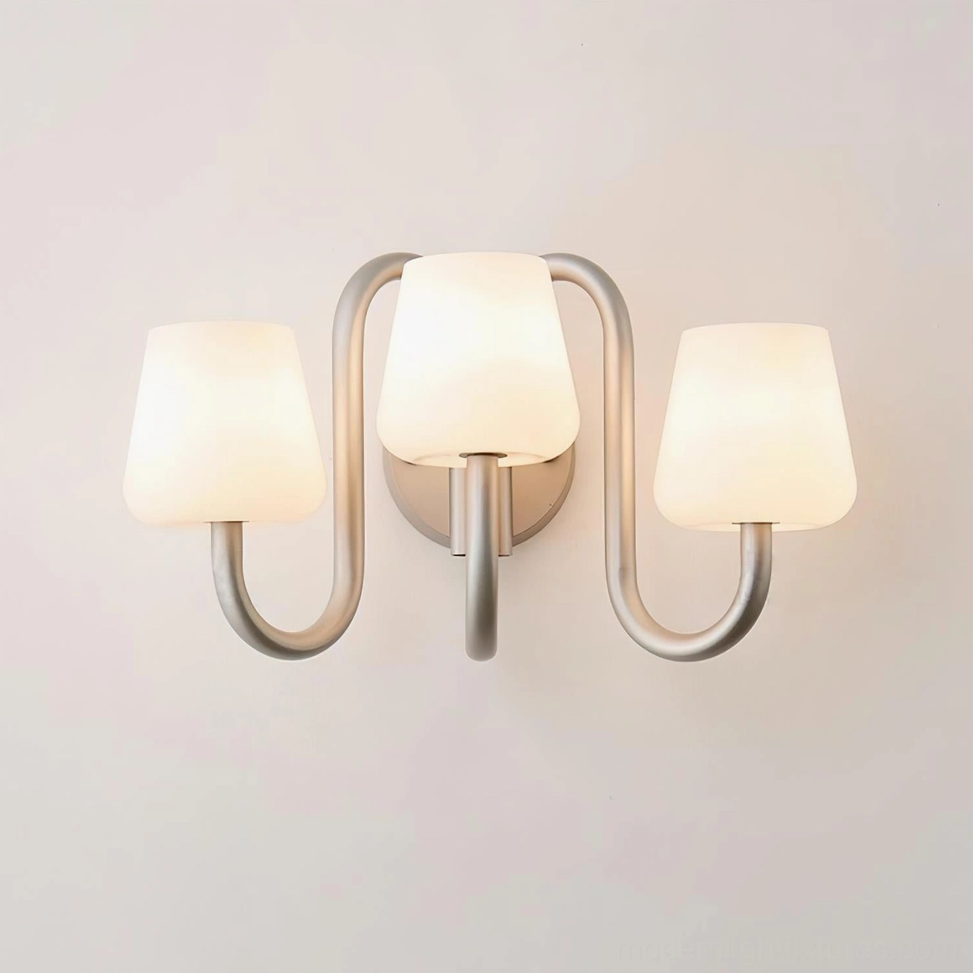 Trilo 3-light wall sconce unlit flat view highlighting brushed silver finish and tapered glass shades