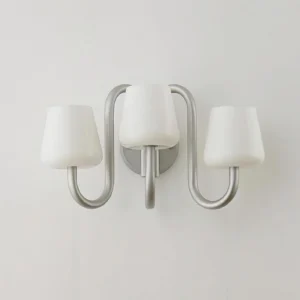 Front view of Trilo wall sconce showing centered glass shade configuration, unlit state