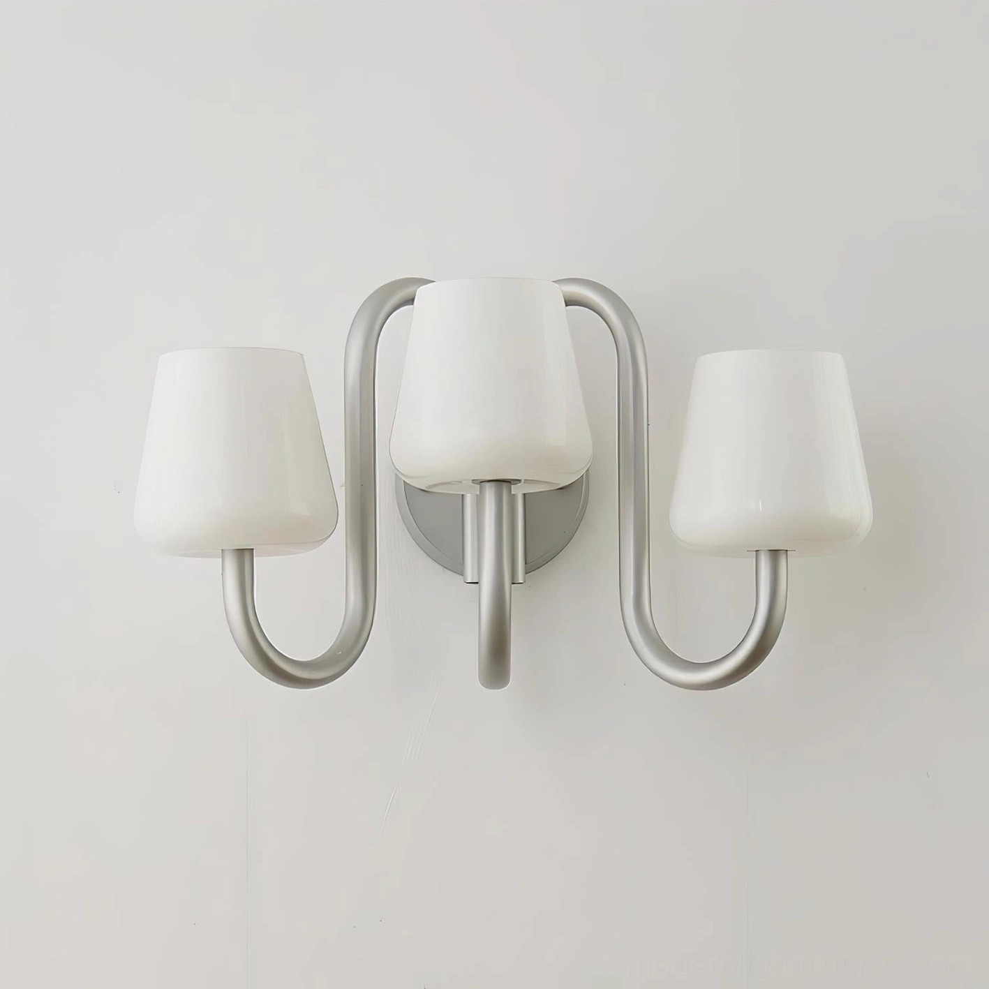 Front view of Trilo wall sconce showing centered glass shade configuration, unlit state