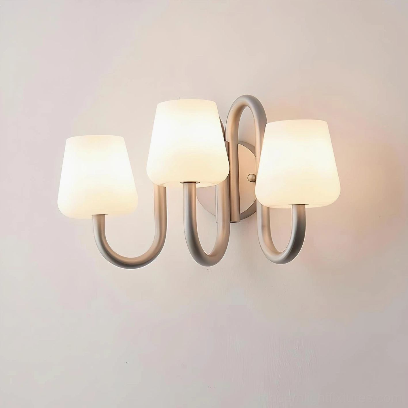Trilo 3-light wall sconce illuminated with warm soft glow, modern minimalist aesthetic