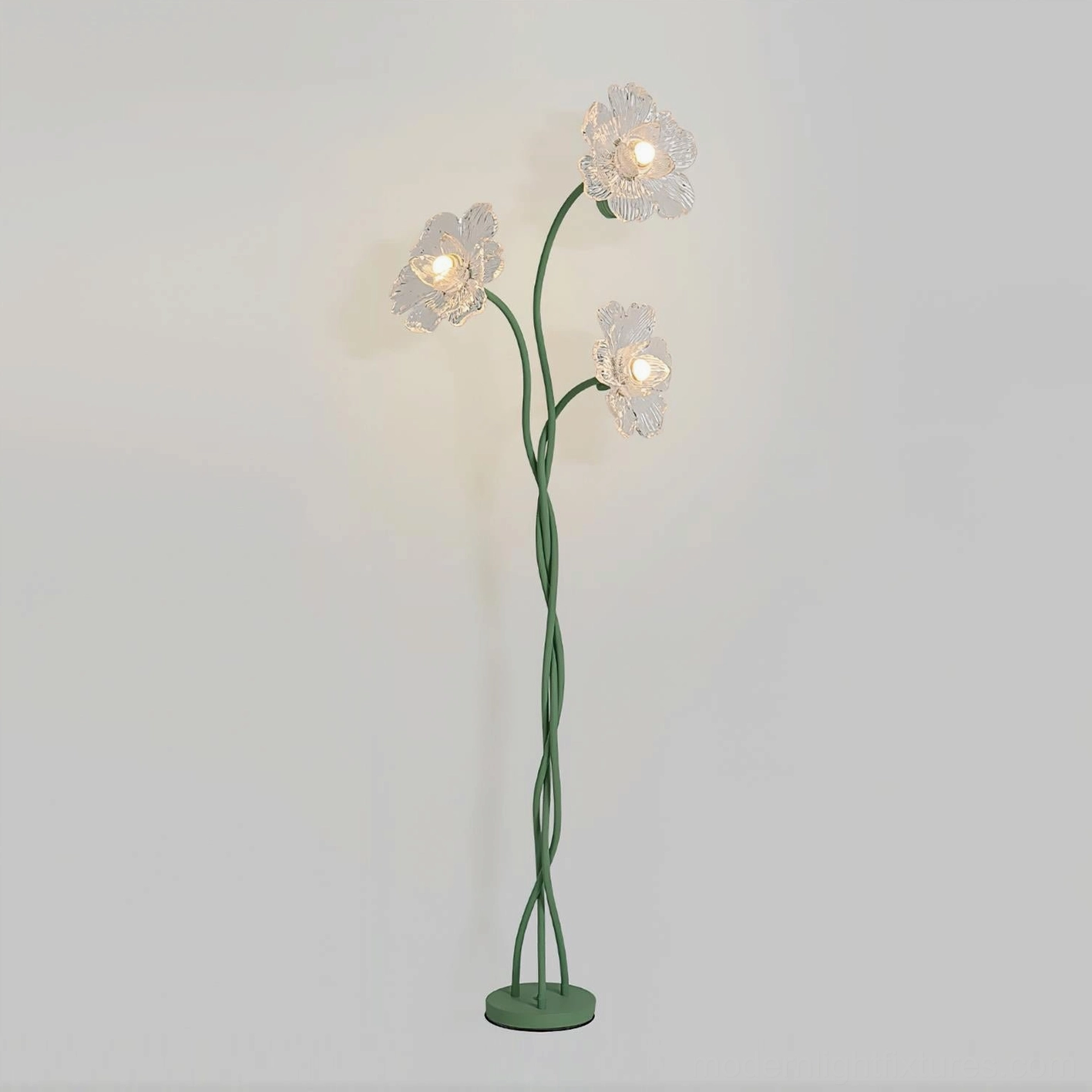Modern floral floor lamp with illuminated glass flower shades and sage green twisted pole, three-quarter angle