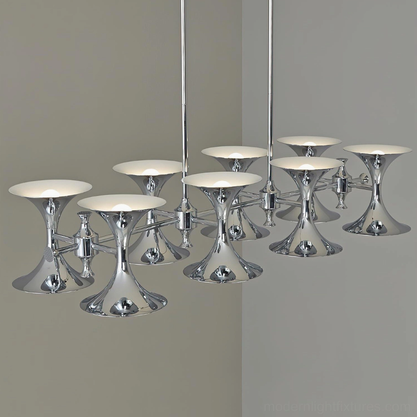 Tromelle 8-head linear chandelier close-up detail showing polished chrome frame and white metal shades