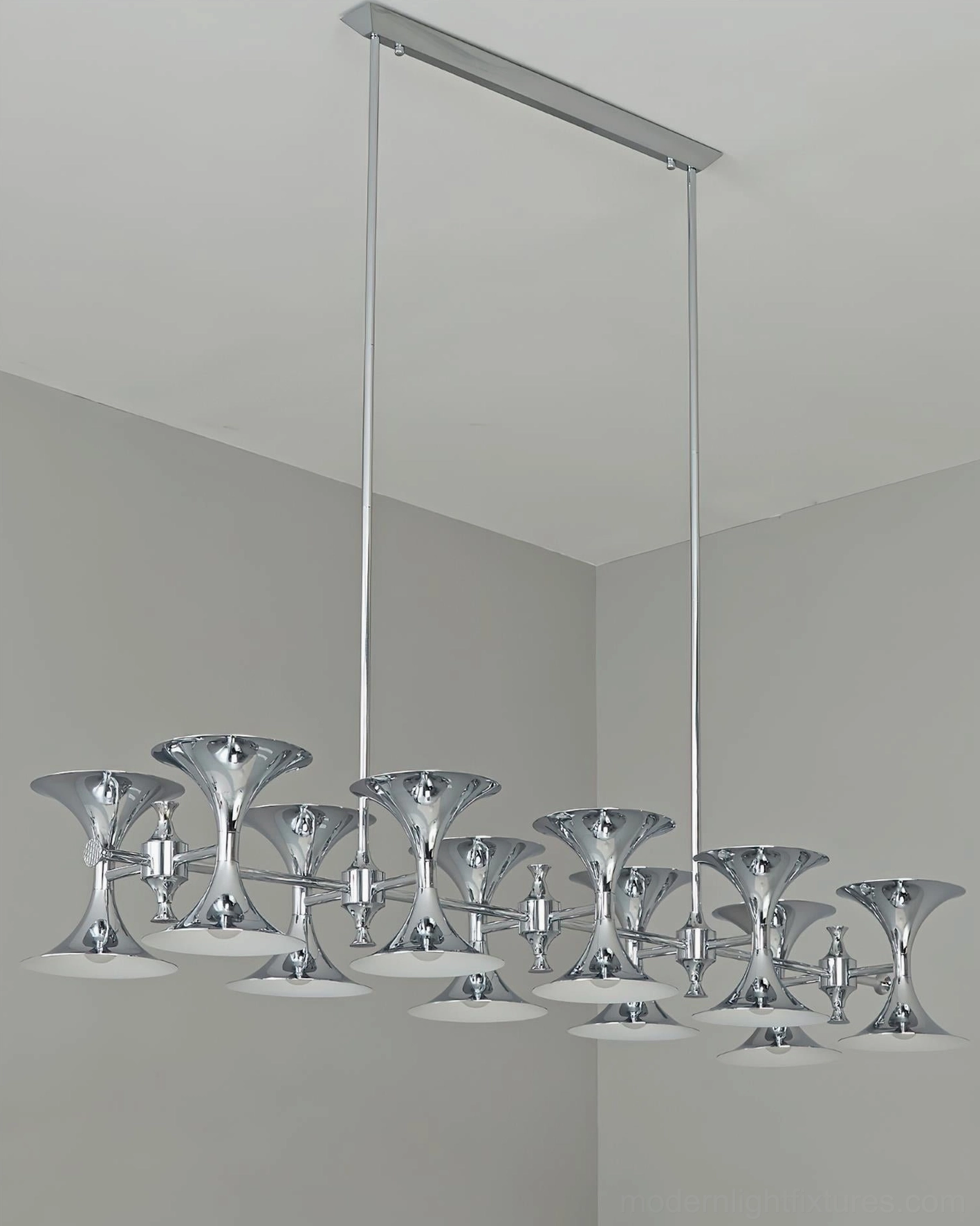 Tromelle modern linear pendant chandelier with chrome finish and trumpet-bell shaped lamp holders