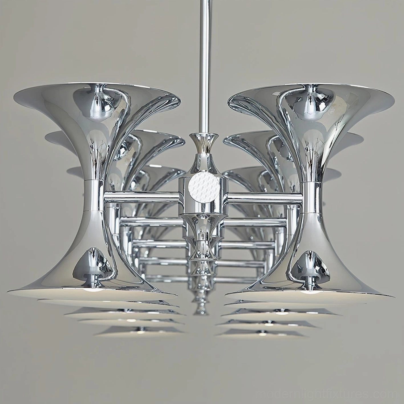 Tromelle modern linear chandelier with sculptural trumpet-shaped design and polished chrome finish