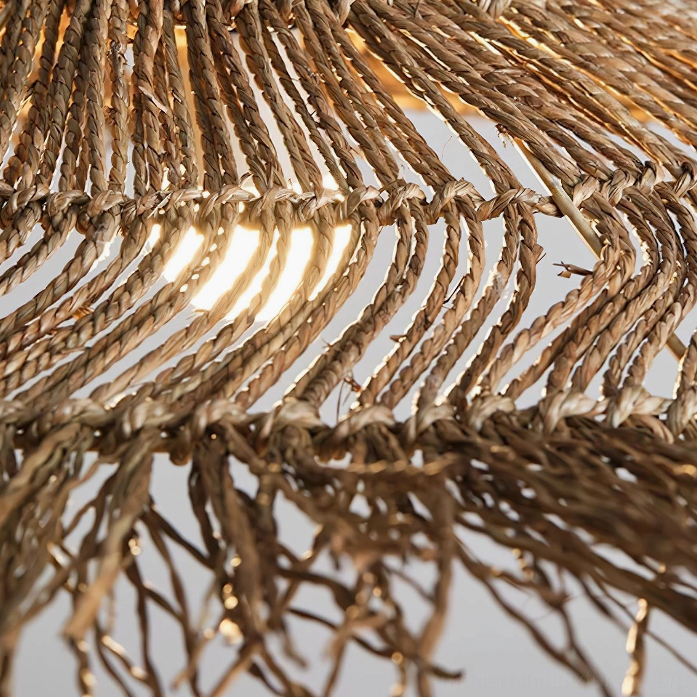 Tropical bohemian interior featuring natural rattan pendant light with palm plants and warm earth-tone decor styling