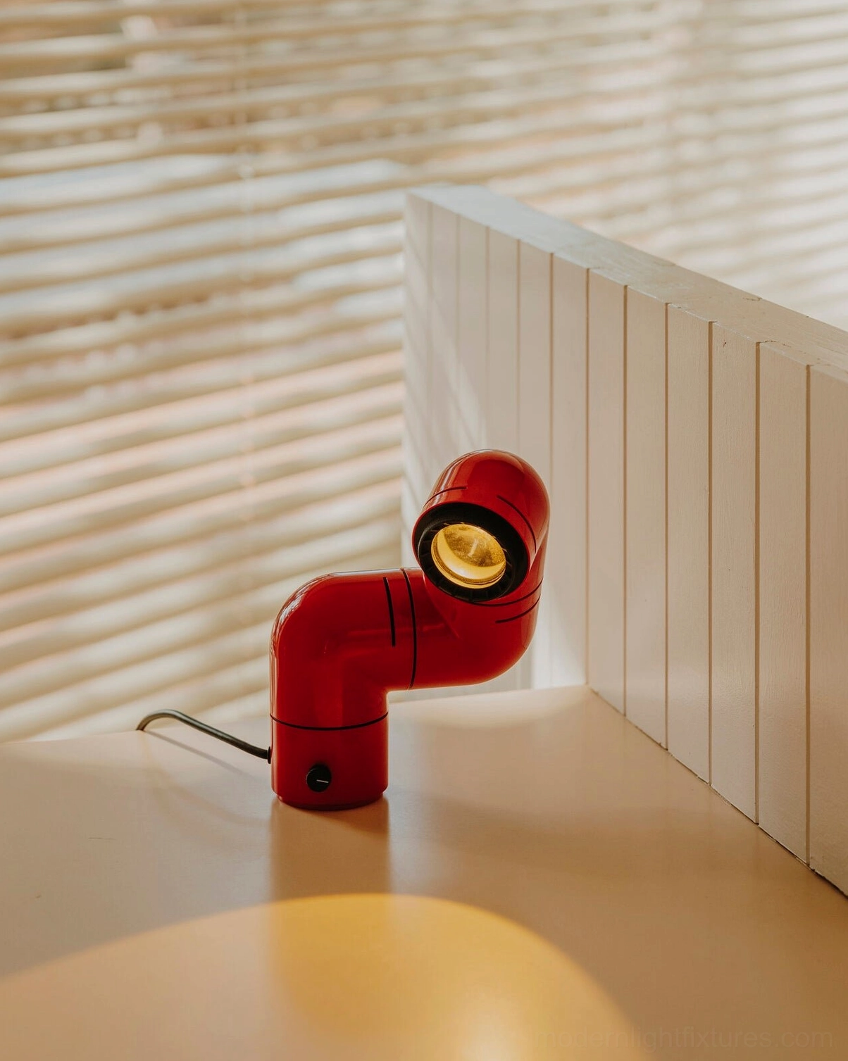 Tubular table lamp displaying neutral 4000K white light output for task lighting