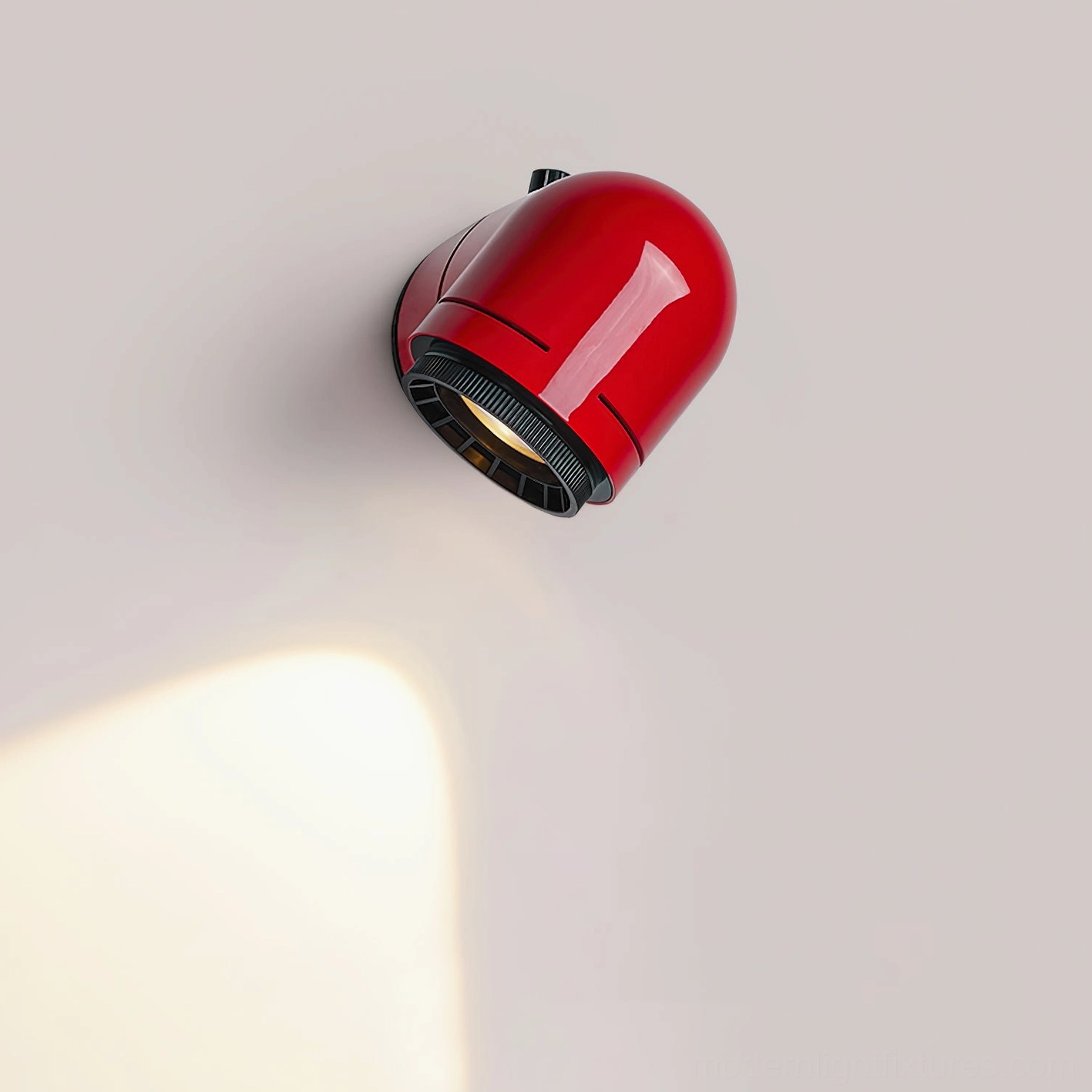 Modern tubular wall sconce from top angle with warm white LED light beam visible inside the fixture head