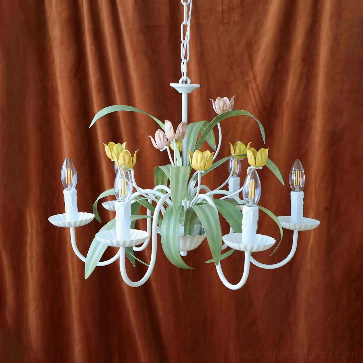 Floral tulip chandelier illuminated burgundy velvet backdrop light purple and yellow painted flowers