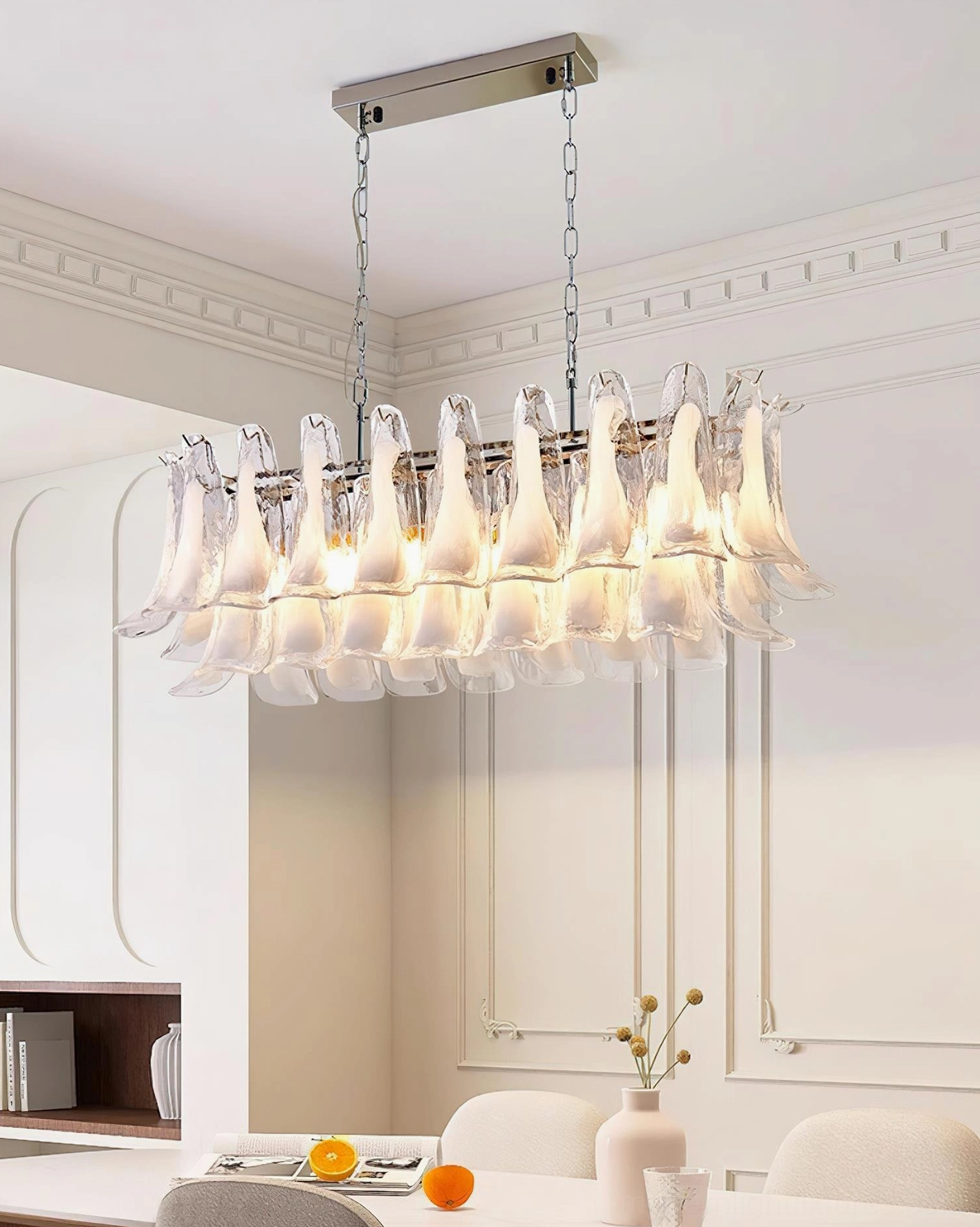 Modern tulip leaf chandelier showing light refraction through Murano glass in evening ambiance