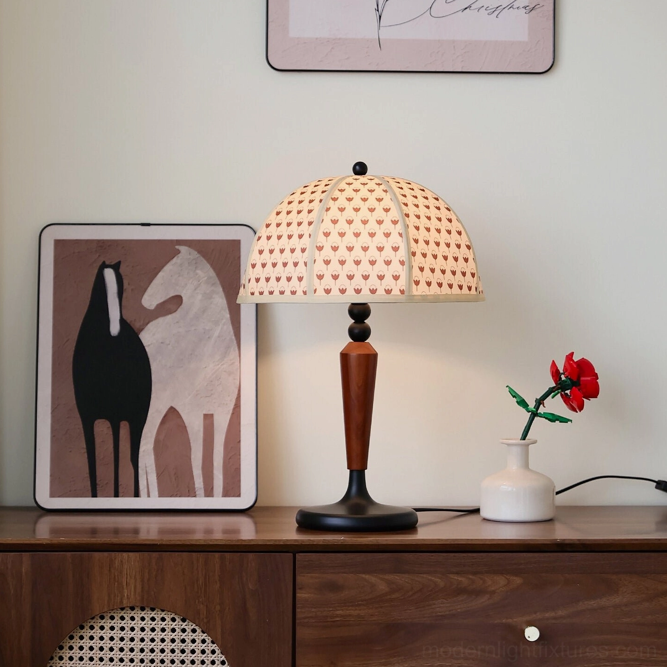 Tulip pattern dome table lamp front view on mid-century console with artwork and flowers