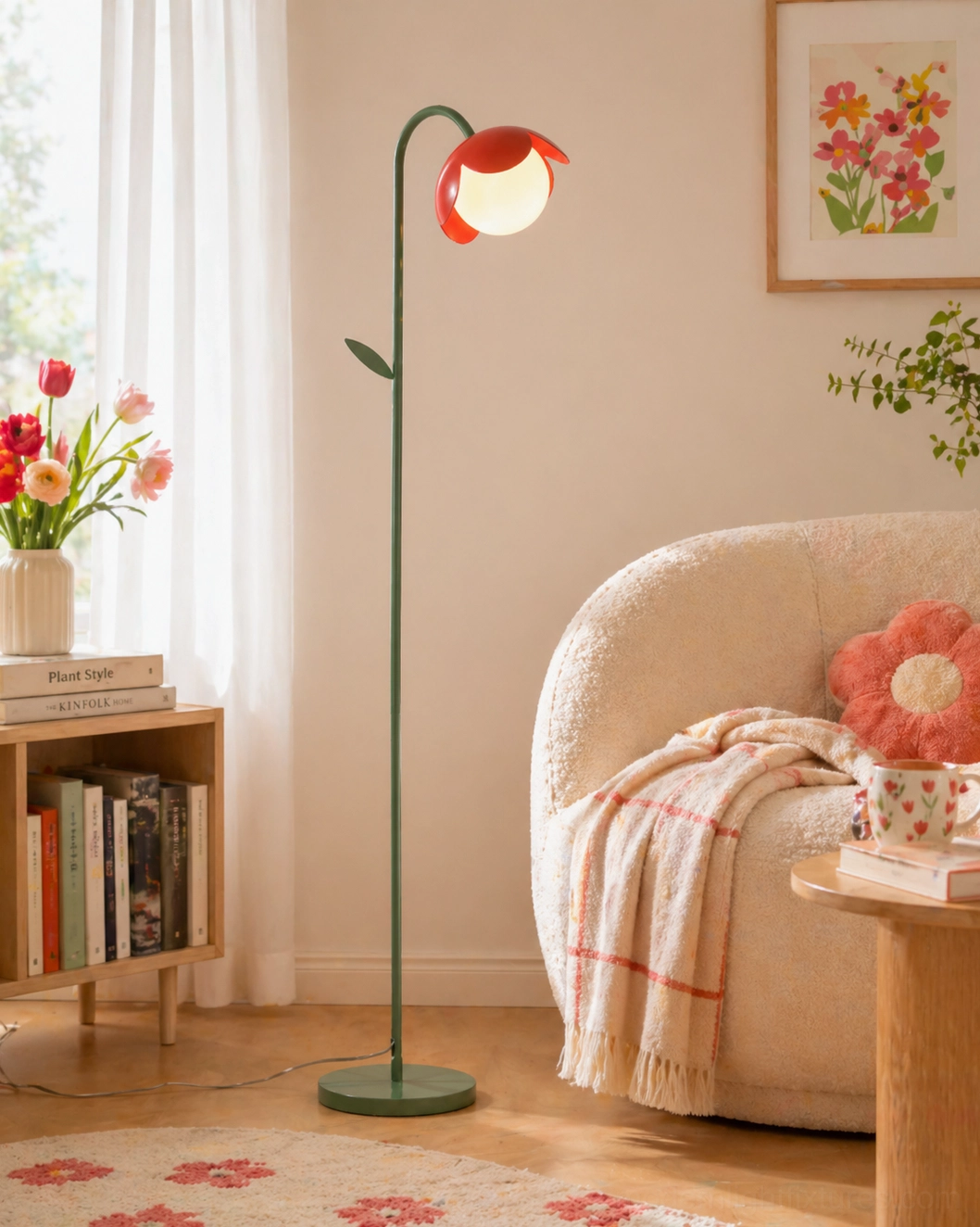 Tulira botanical floor lamp beside fabric sofa with red flower shades, cozy living room with floral wall art decor