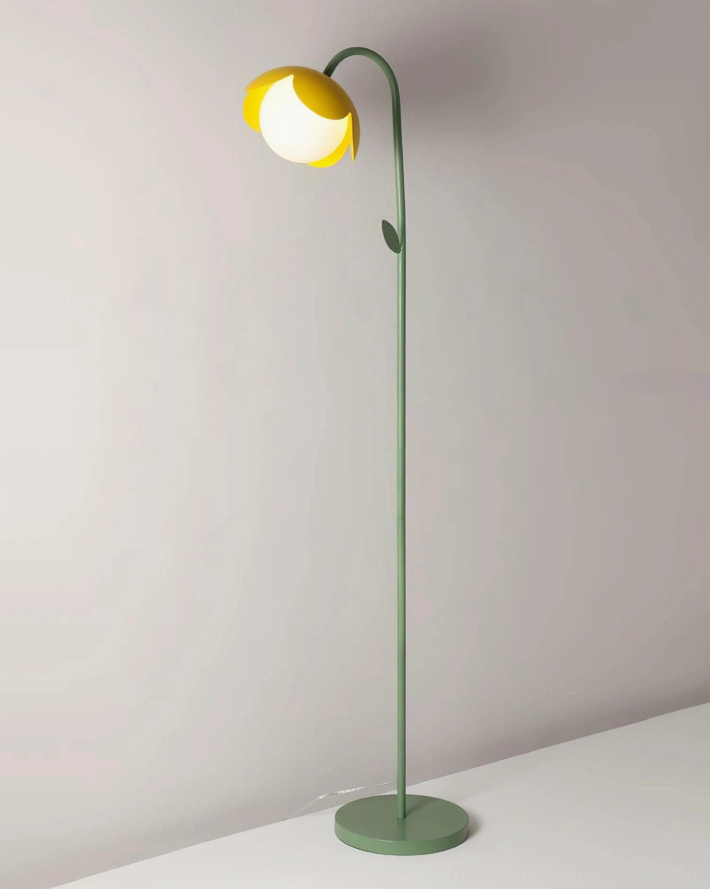 Tulira botanical floor lamp low angle view with yellow petal shades, matte green metal stem, modern sculptural lighting fixture