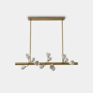 Tuloria linear brass chandelier with 13 white porcelain flowers and G4 lights, front studio view
