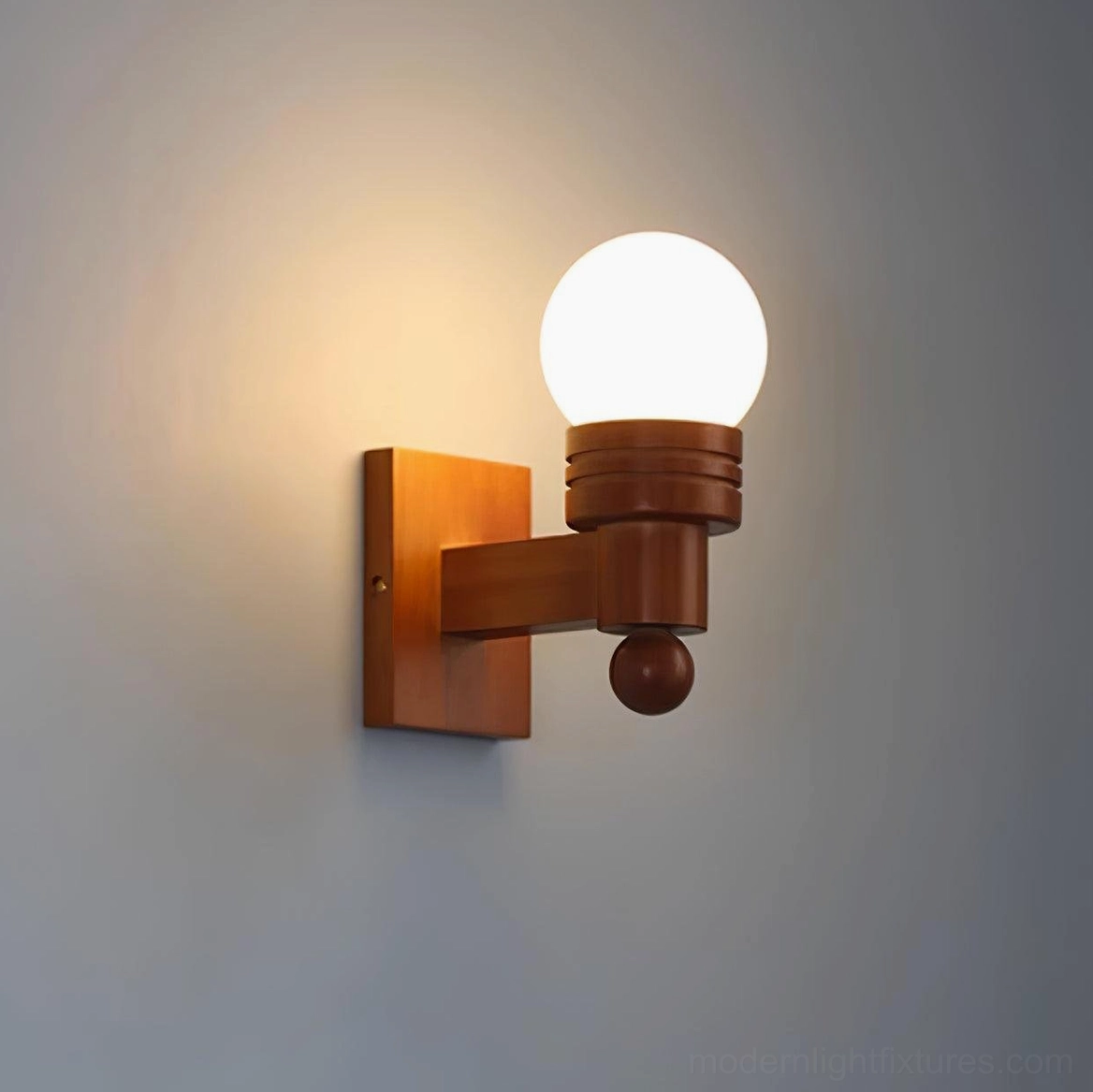 Tupelo wall lamp showing light diffusion through frosted glass shade and warm ambient effect