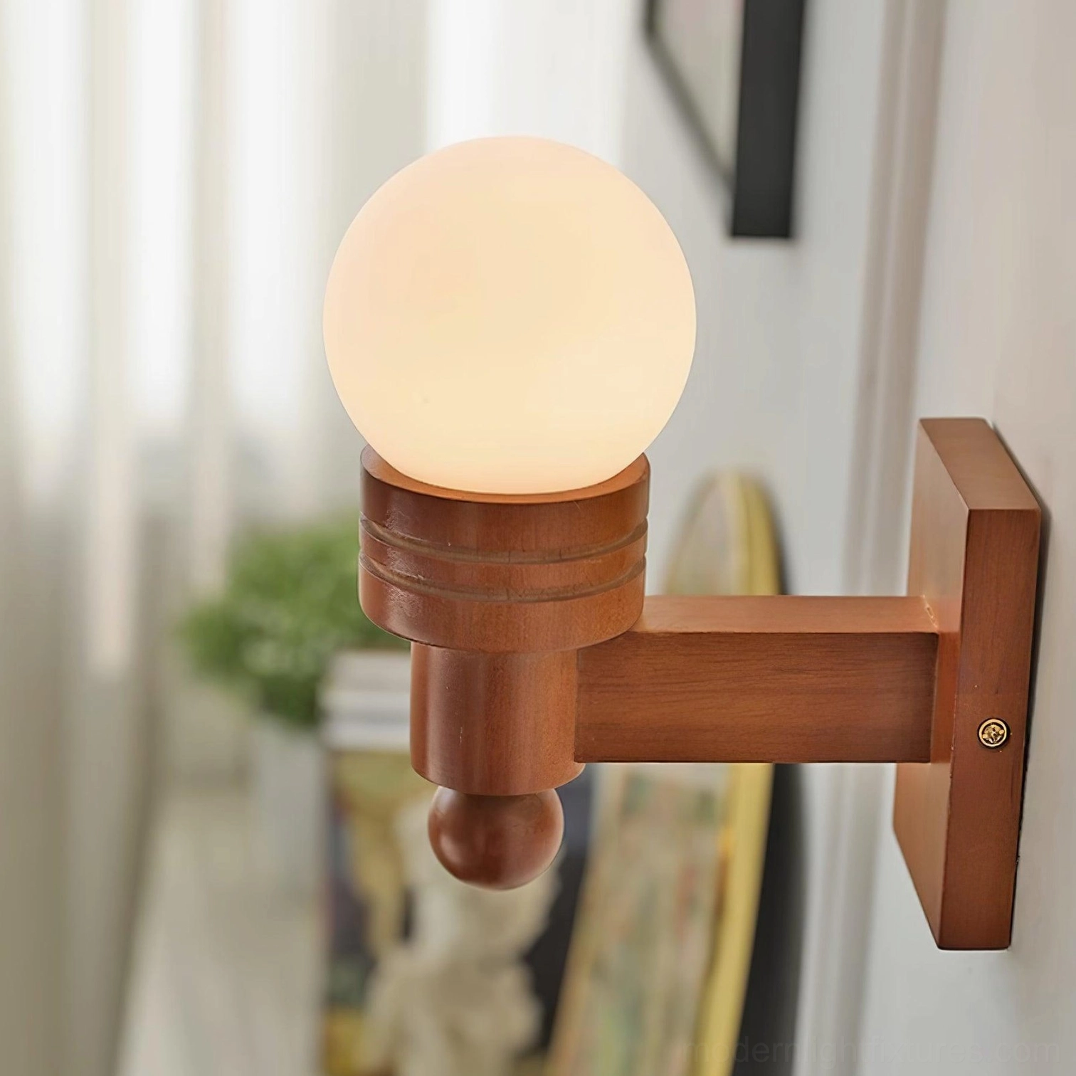 Tupelo wall sconce in walnut finish showing natural wood grain and premium material quality