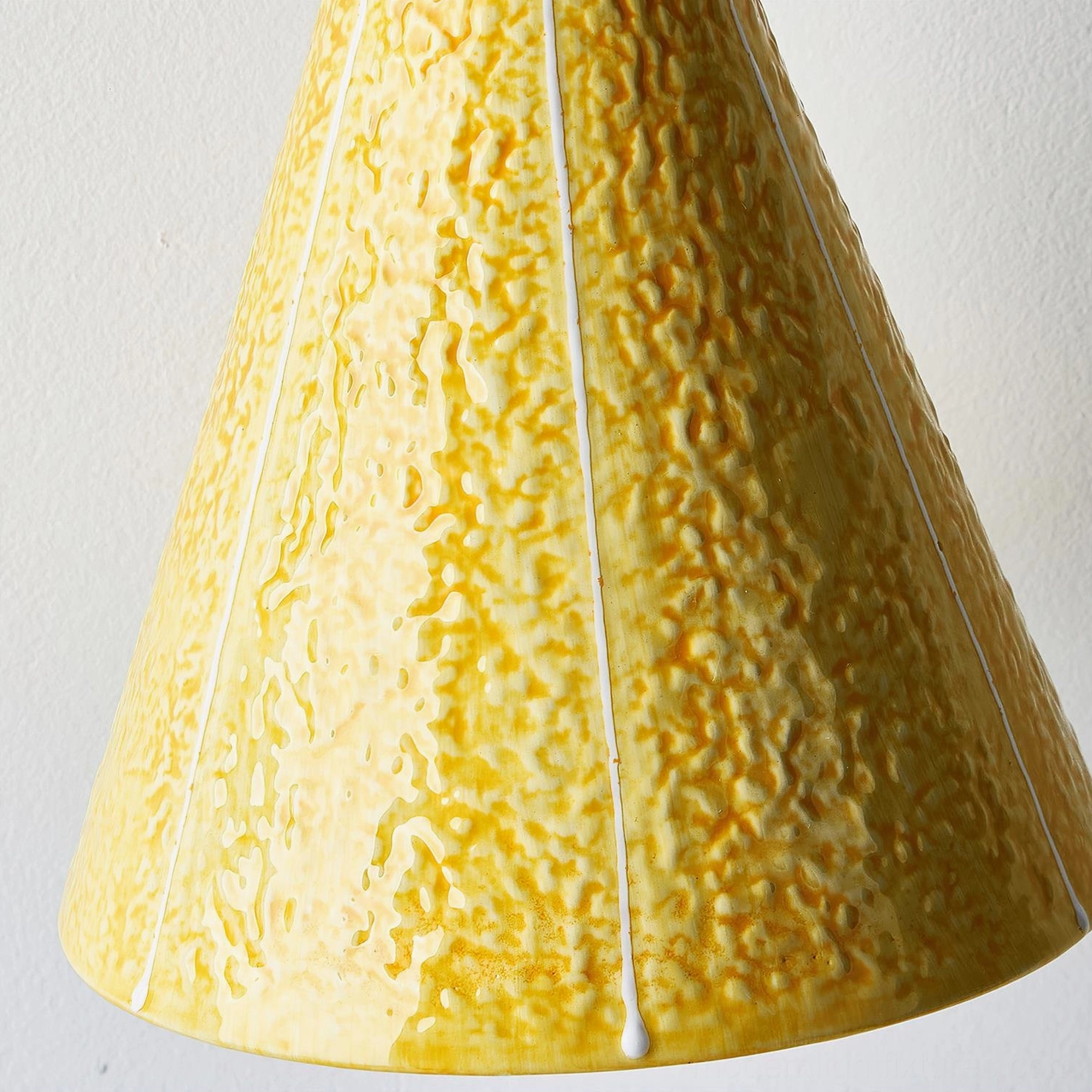 Tweetie bird wall sconce showing complete design with warm light distribution and textured yellow finish