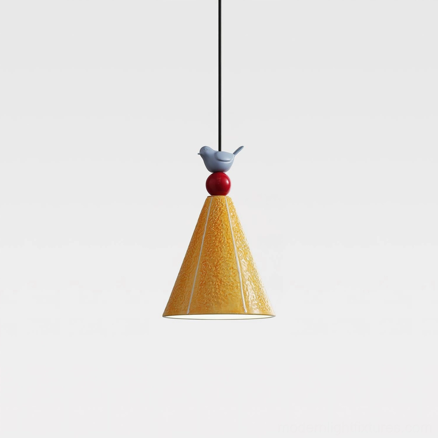 Unlit ceramic pendant lamp with bird ornament against white background, showing textured yellow shade and glossy sphere