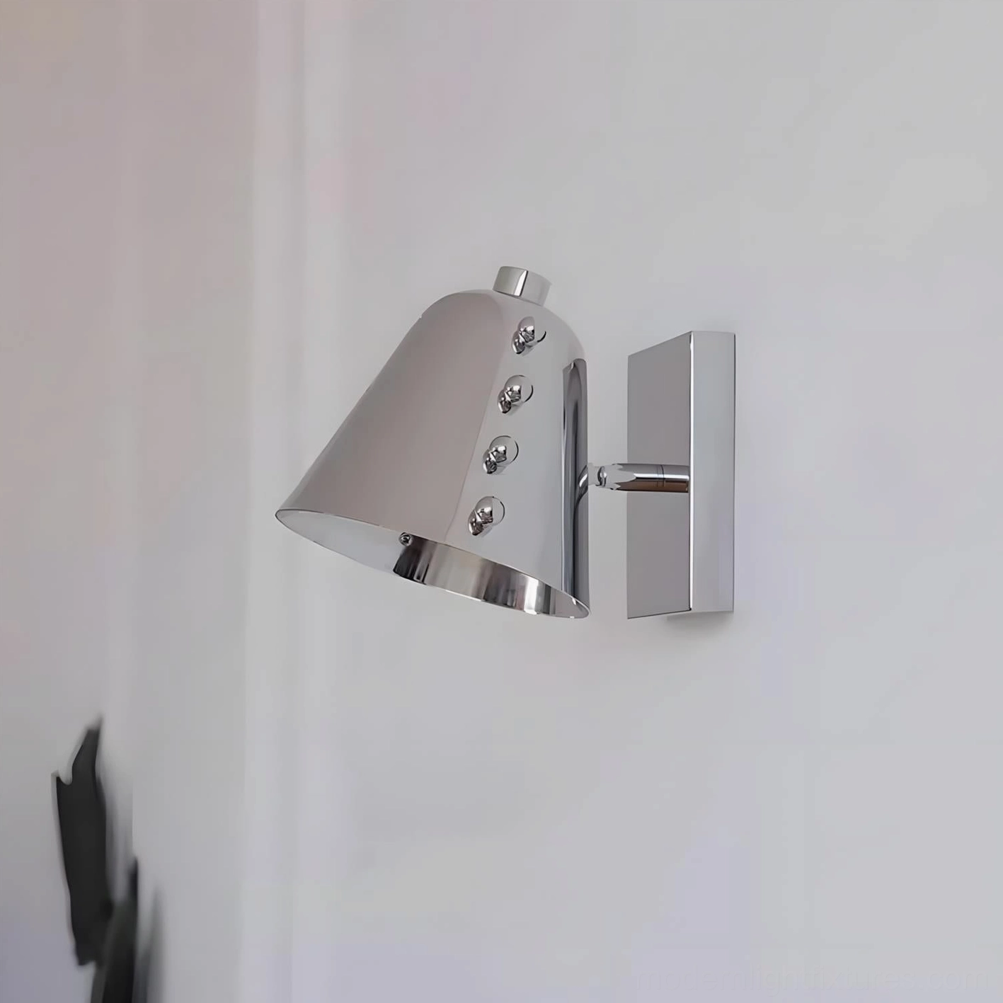Twilight pin wall sconce in modern interior setting, versatile finish option for contemporary home design