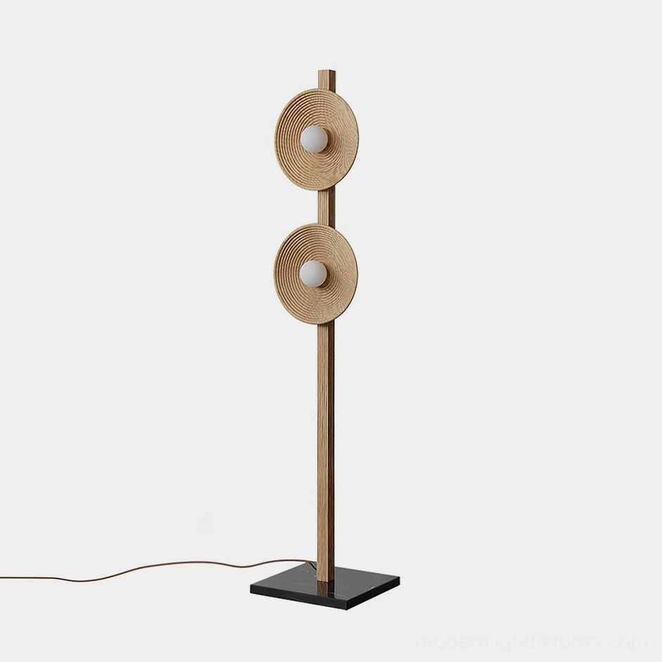 Twin disc modern floor lamp front view with dual wooden discs and black marble base on plain white background
