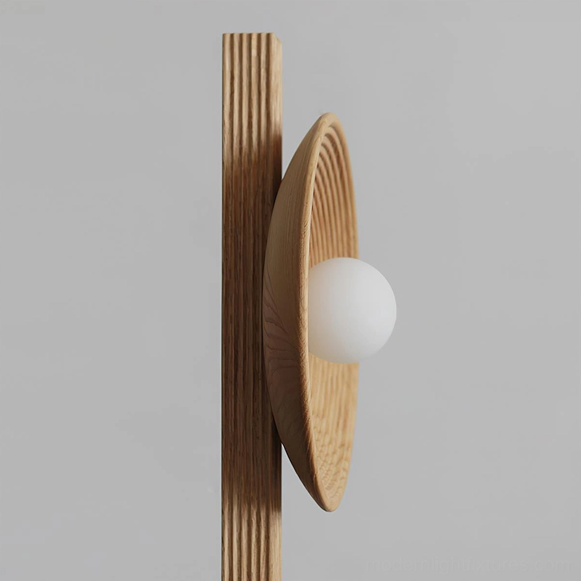 Twin disc floor lamp extreme close-up showing radial grooved wood texture and white globe bulb detail