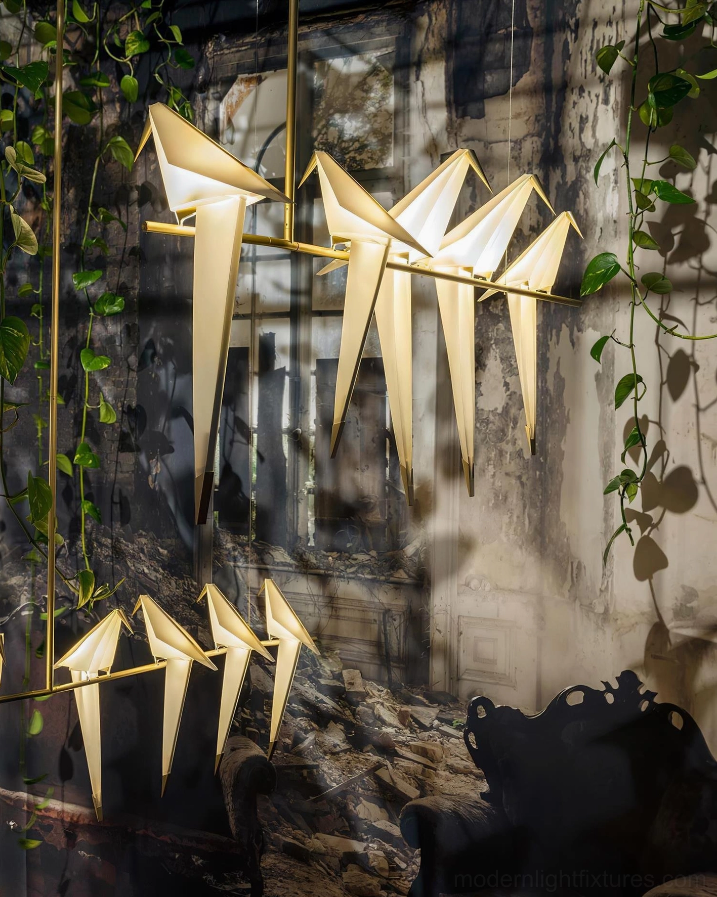 Dual origami crane chandeliers in industrial vintage dining room with greenery