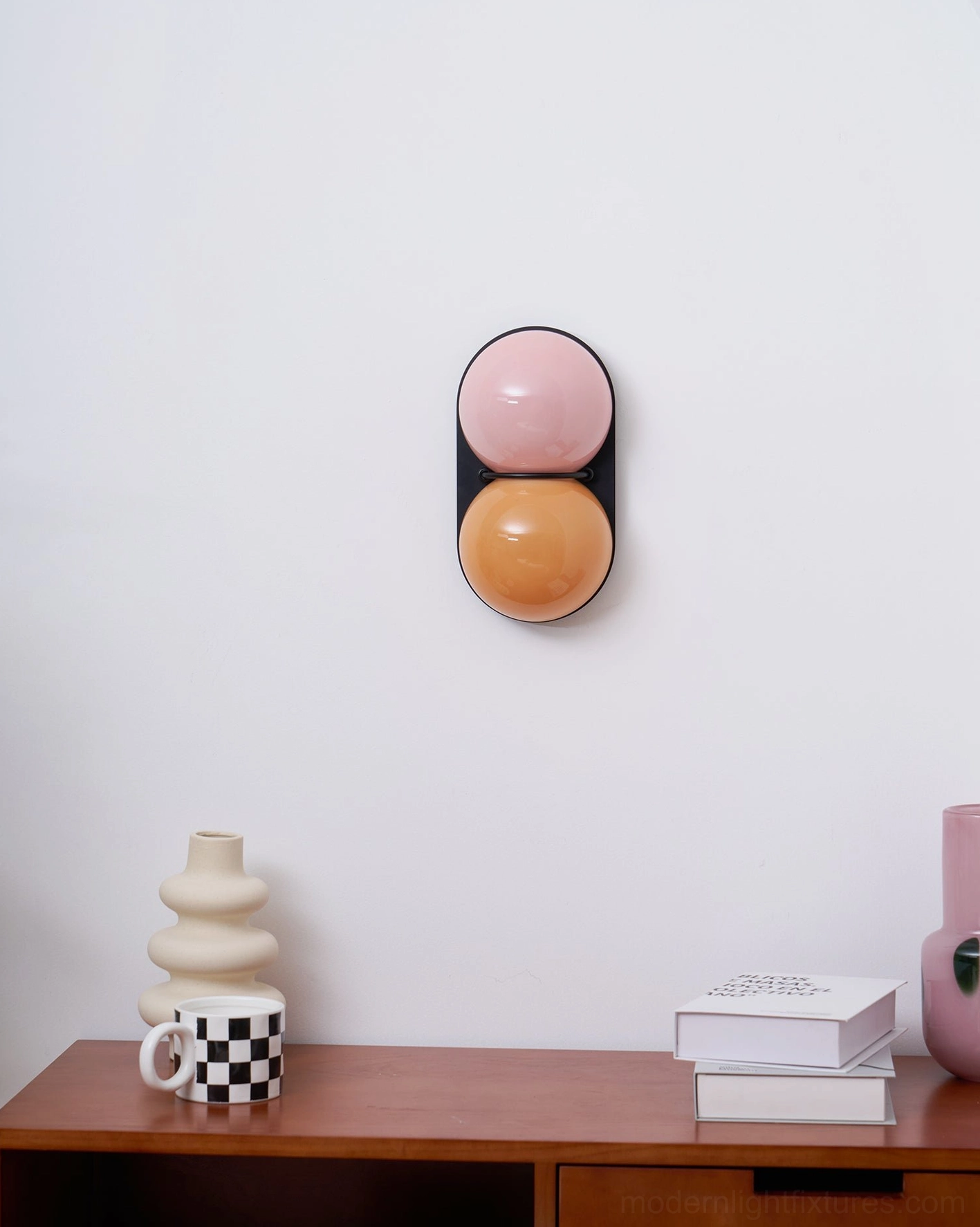 Twin Twinwave double globe wall sconces in modern Nordic bedroom creating serene lighting