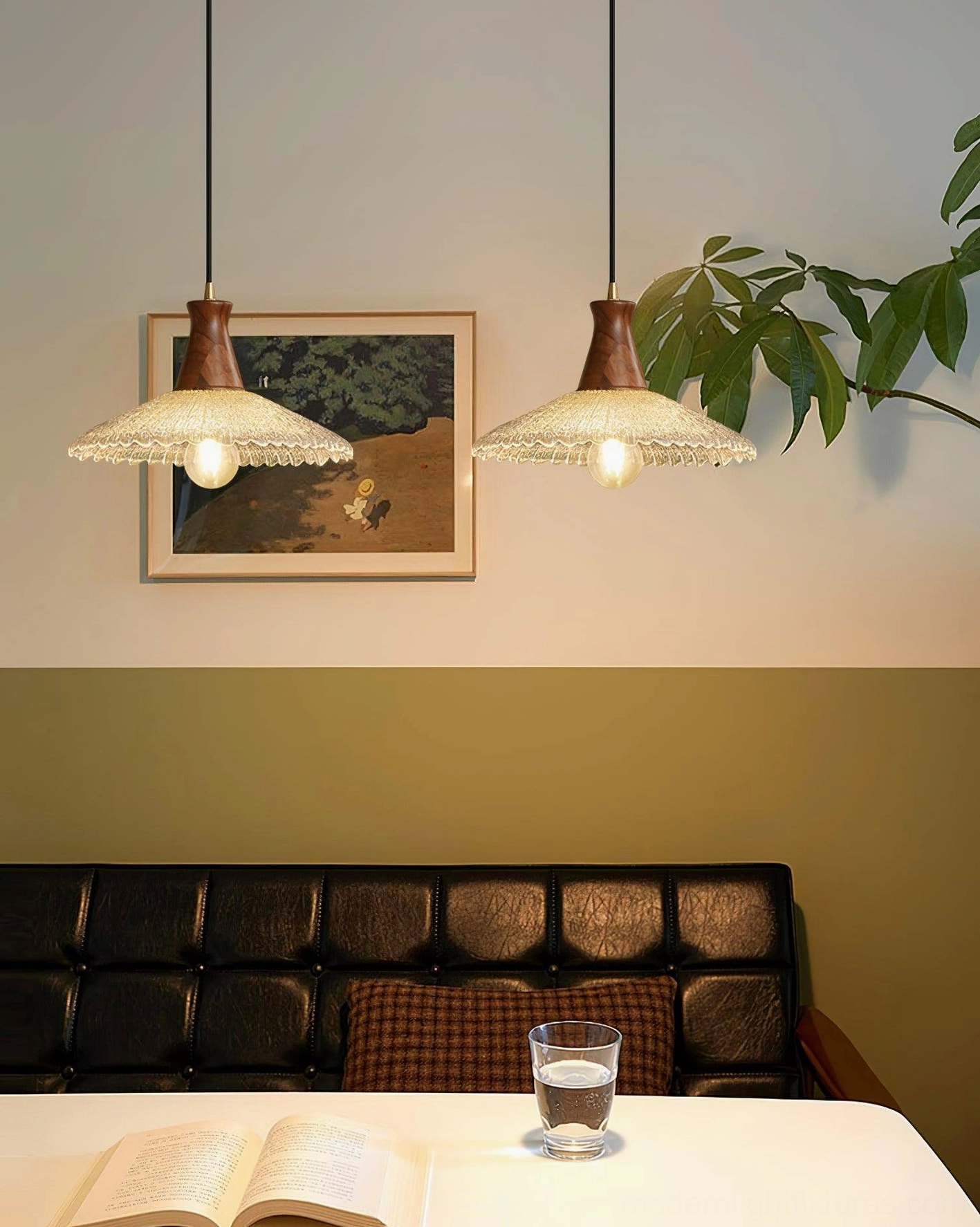 Pair of matching walnut wood pendant lights in warm retro living space with solid wood accents