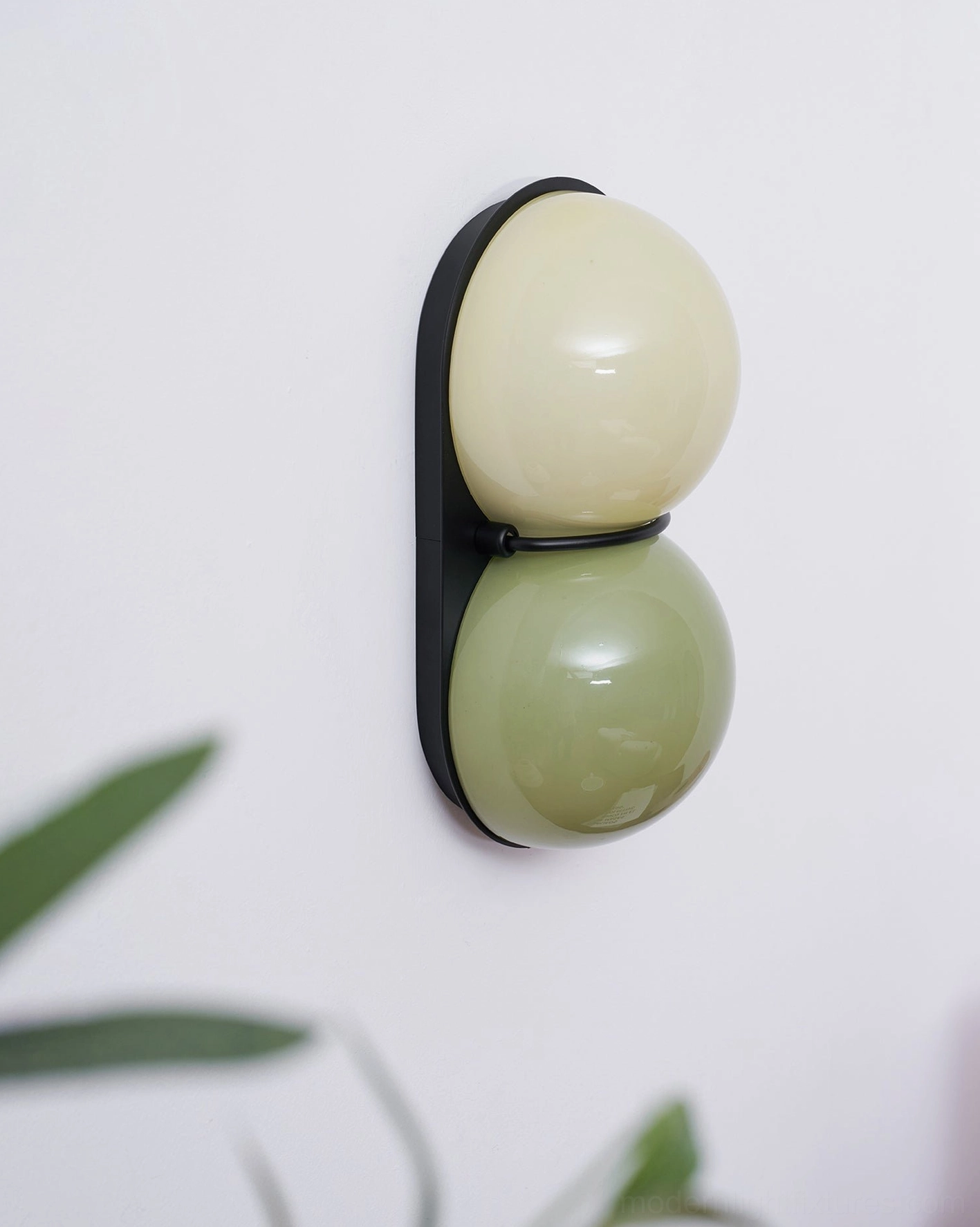 Twinwave double globe wall sconce providing balanced contemporary illumination in modern home