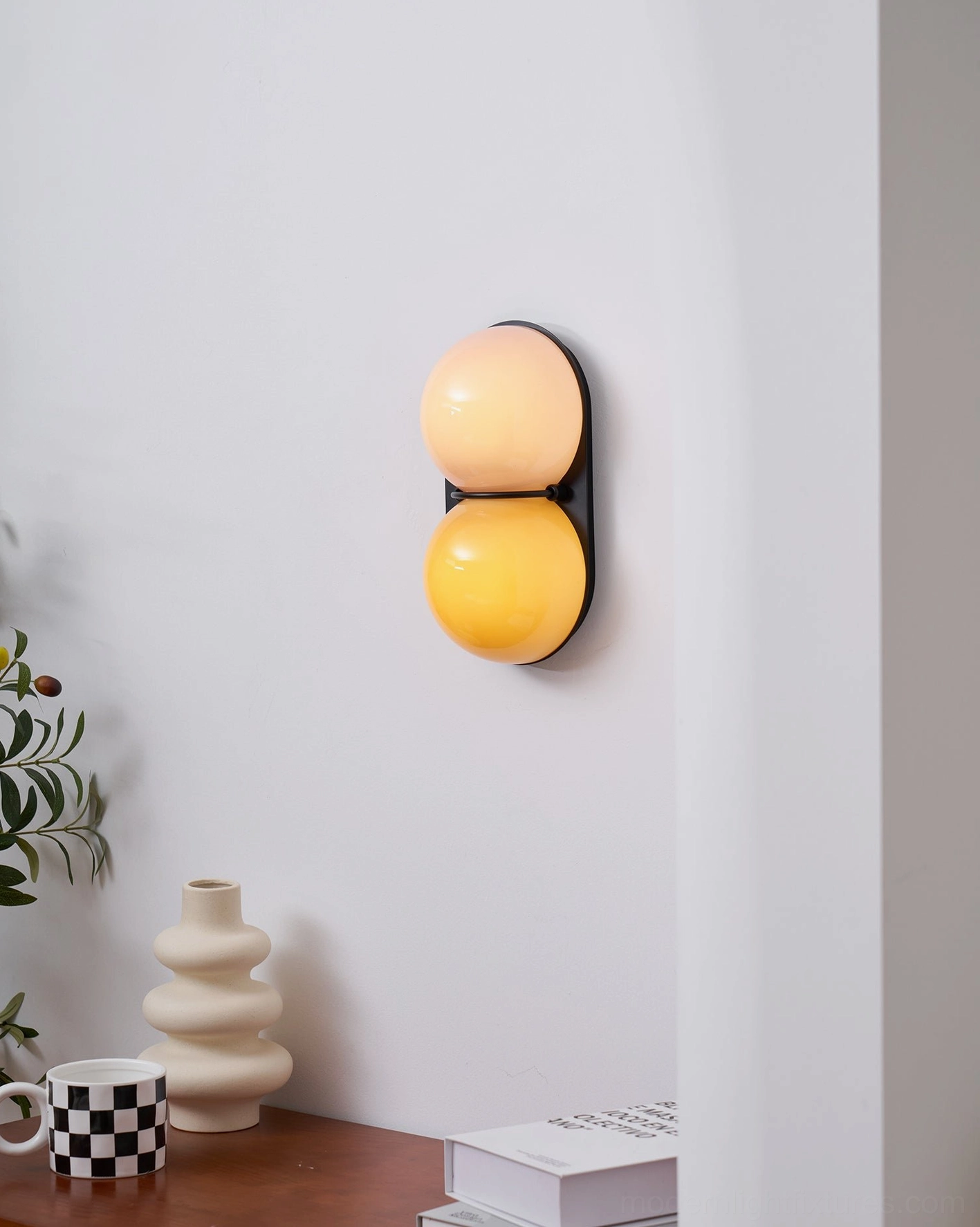 Twinwave double sphere wall light fixture with black metal frame and gradient glass detail