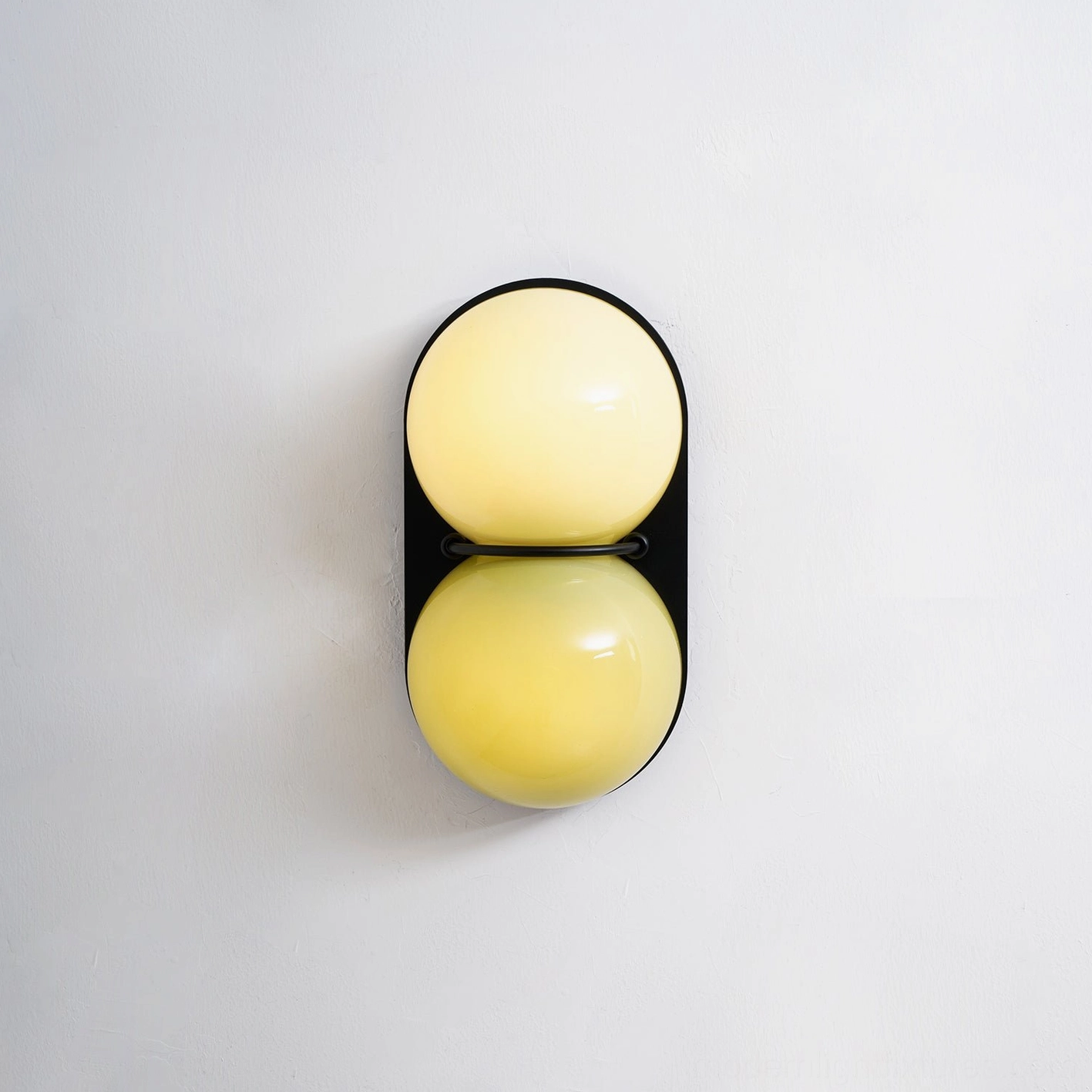 Twinwave wall light double orb sconce with sculptural metal frame in contemporary home