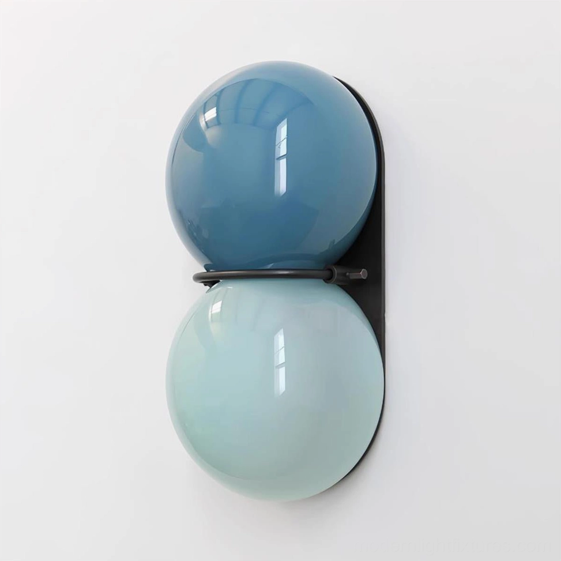 Twinwave wall sconce black and blue glass variant installed in modern home accent wall